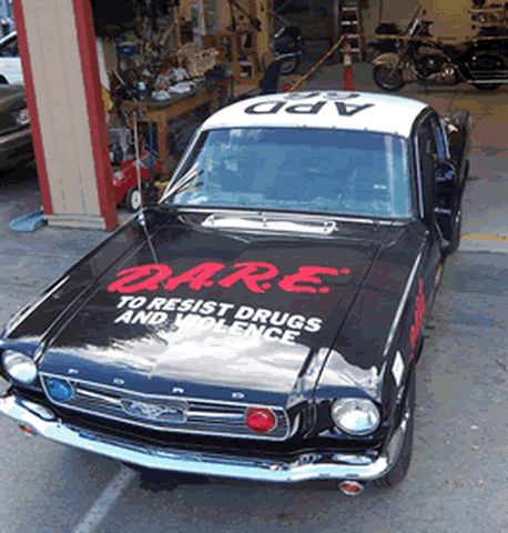 1991 Ford Crown Victoria - This classic Ford Mustang has been converted into a police car with D.A.R.E. branding.