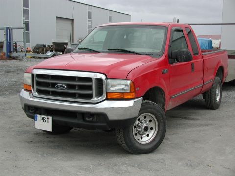 1999 Lincoln Town Car - This red Ford F-250 truck has a chrome grille and an 'F250' badge, indicating it is not a Lincoln Town Car.