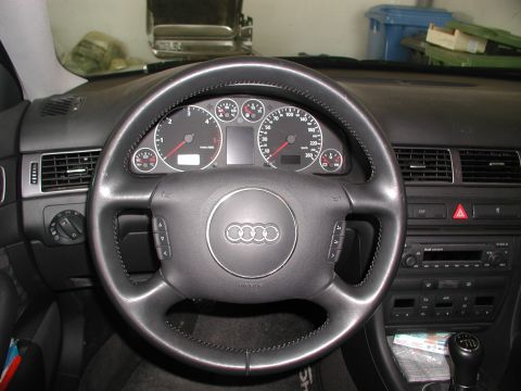 2003 Audi A6 - The interior of a 2003 Audi A6 shows the dashboard, steering wheel, and center console.