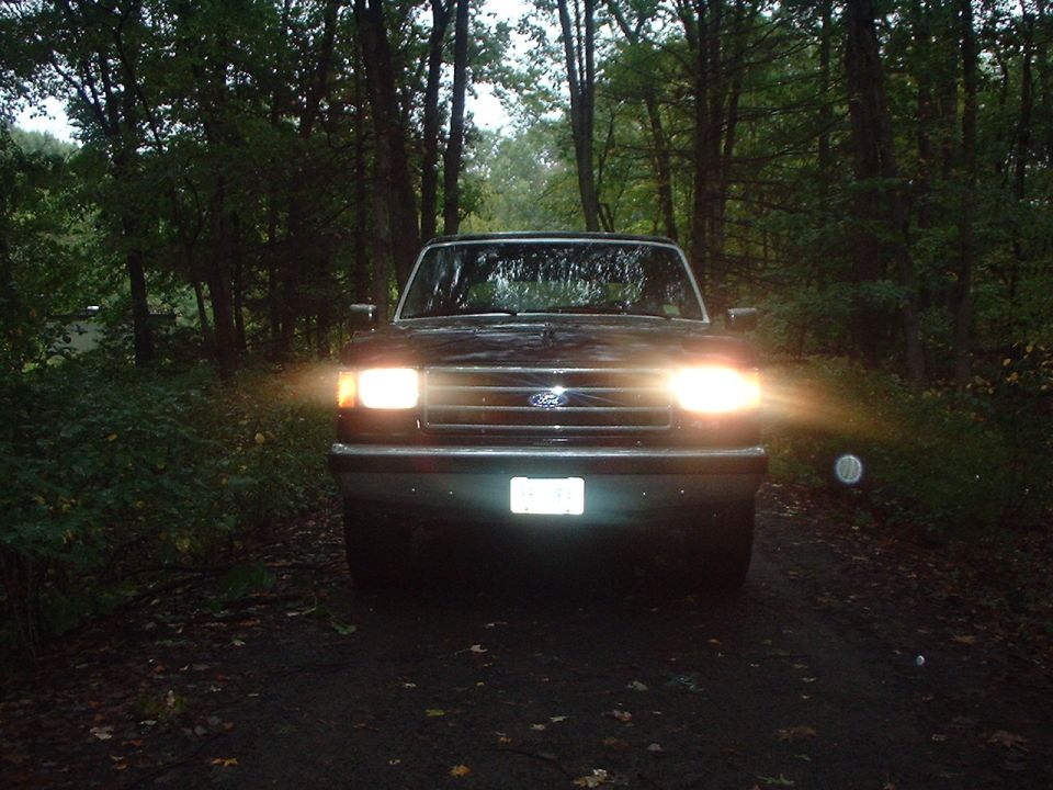 1989 Ford Bronco front view with headlights on