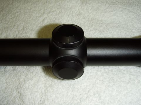 2004 Harley-Davidson Fat Boy - A black rifle scope is shown on a white, textured surface.