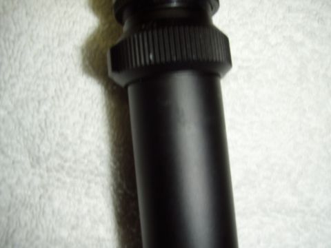 2004 Harley-Davidson Fat Boy - Close-up view of a black motorcycle component, possibly a shock absorber or exhaust piece.