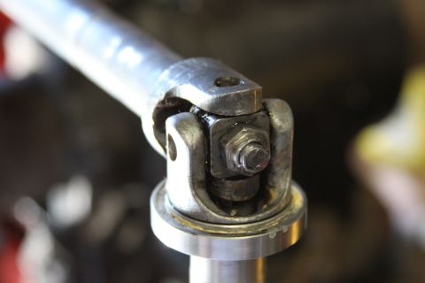 1979 Ford Bronco - Close-up view of a steering shaft universal joint, secured by a hex bolt.