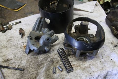 1979 Ford Bronco - Steering column parts laid out for repair on a workbench.