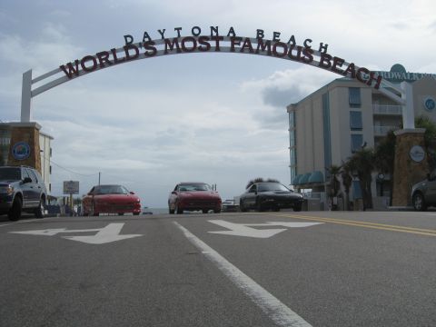 1994 Ford Probe - Cars drive under the Daytona Beach arch, marking the entrance to the world's most famous beach.