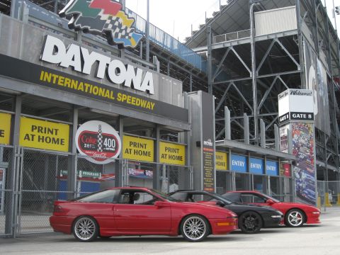 1994 Ford Probe - Three Ford Probe models are parked outside the Daytona International Speedway entrance.