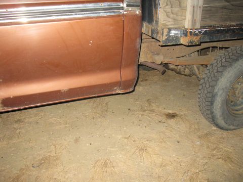 1977 Ford F-250 - Close-up view of the rear side panel and bed of a truck, showing some rust and wear.