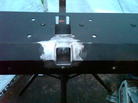 1987 Suzuki Samurai - A trailer hitch receiver part is shown with evidence of recent welding.