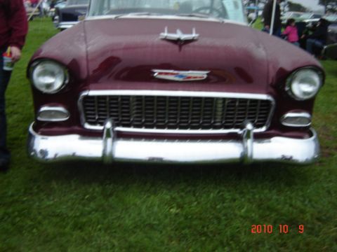 1993 Ford Bronco - Front view of a maroon 1955 Chevrolet Bel Air, identified by its distinctive grille and hood ornament.