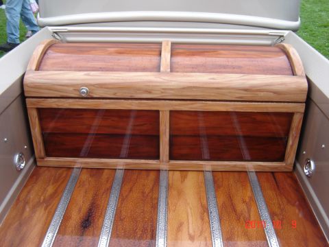 1993 Ford Bronco - A custom wooden chest is mounted in the bed of a pickup truck with a polished wood floor.