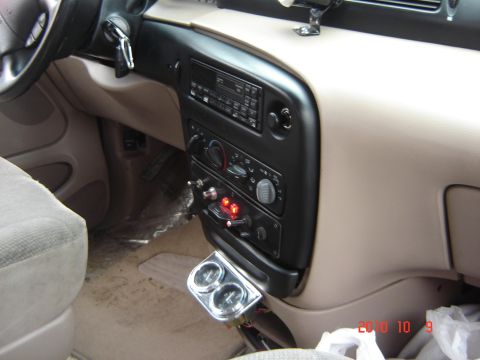 1993 Ford Bronco - Aftermarket gauges are installed below the center console of this vehicle's interior.