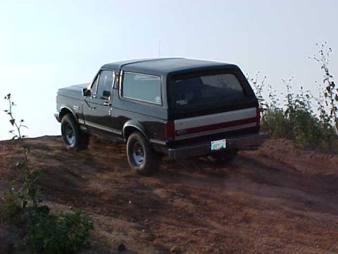 1989 Ford Bronco - 1989 Ford Bronco on a dirt hill.