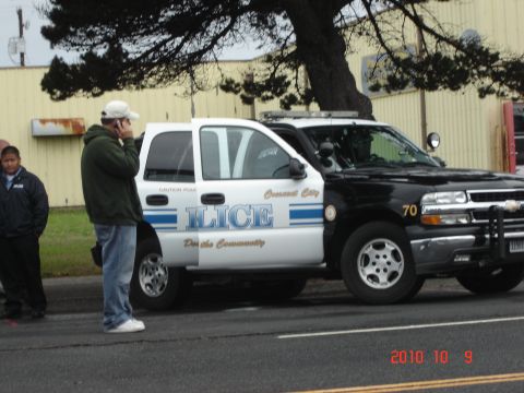 1993 Ford Bronco - A police SUV with 'ILICE' and 'Crescent City' text is parked on the street.