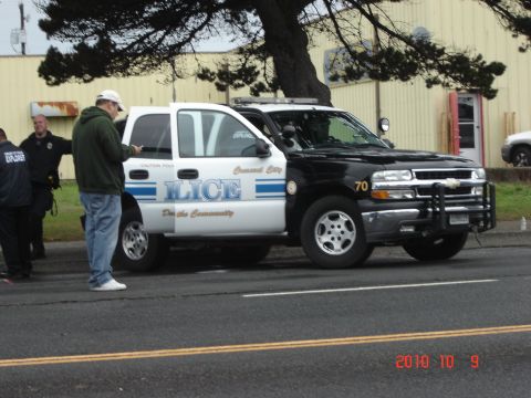 1993 Ford Bronco - Police SUV with 'POLICE' and 'Crescent City' text is seen on the street with officers present.