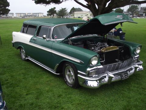 1993 Ford Bronco - This two-tone station wagon, likely a 1956 model, is displayed with its hood open, revealing the engine bay.