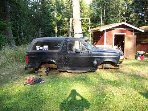 1995 Ford Bronco - This 1995 Ford Bronco is missing its wheels and appears to be undergoing some form of repair or modification.