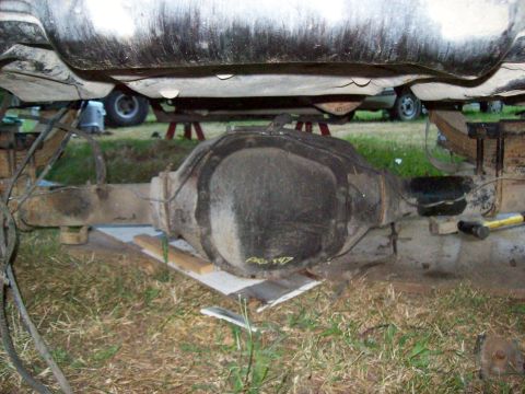 1995 Ford Bronco - Rear axle assembly shown from underneath, supported by blocks.