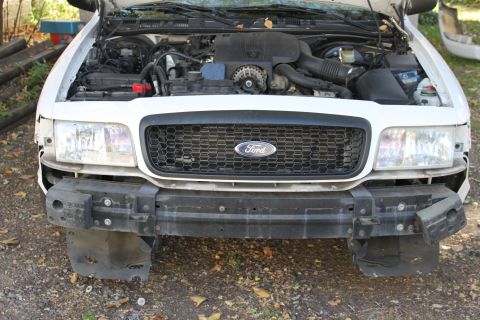 2003 Ford Crown Victoria - bumper removed with bare 5038 brackets mounted to the bumper reinforcement .. apparently the shock absorbers were removed to install the pu…