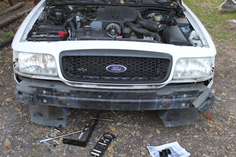 2003 Ford Crown Victoria - 5038 brackets removed. ** the bumper reinforcement was bent on the top and bottom from the brackets.
