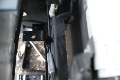 2003 Ford Crown Victoria - the top bracket will bolt into a bracket that slides under the top of the bumper and bottom of the header panel to mount the top part of th…