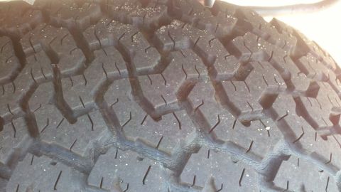 1988 Ford Bronco - A detailed view of a tire's tread pattern, showing texture and wear. The image includes a watermark for Supermotors.net.