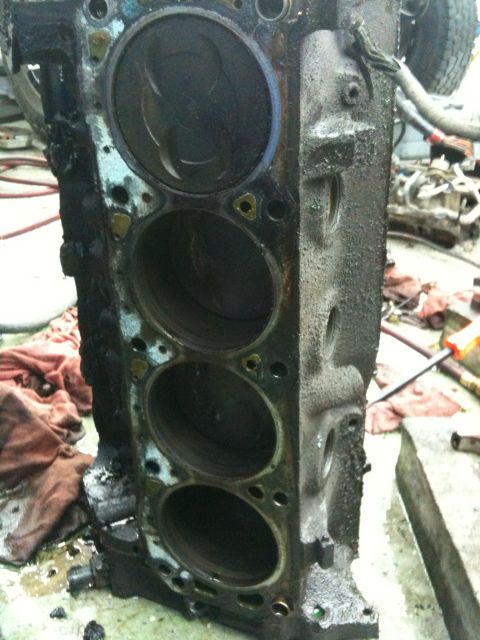 1990 Ford Bronco - Close-up view of an engine block, showing the cylinder bores and pistons within.