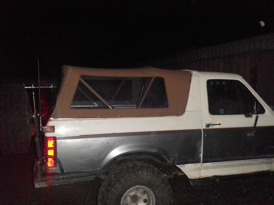 1991 Ford Bronco with brown soft top, side view