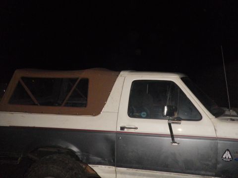 1991 Ford Bronco - This Ford Bronco features a two-tone paint scheme and a removable soft top for open-air driving.
