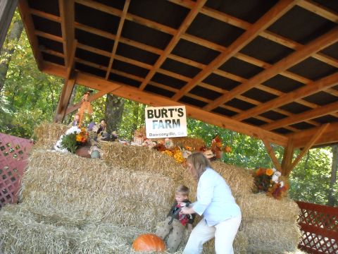 1979 Ford F-150 - A farm stand decorated with hay bales, pumpkins, and autumn flowers features a sign for Burt's Farm in Dawsonville, GA.