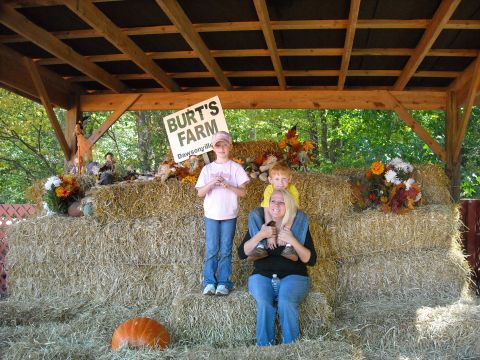 1979 Ford F-150 - A family enjoys a fall day at Burt's Farm, with hay bales and a pumpkin as props.