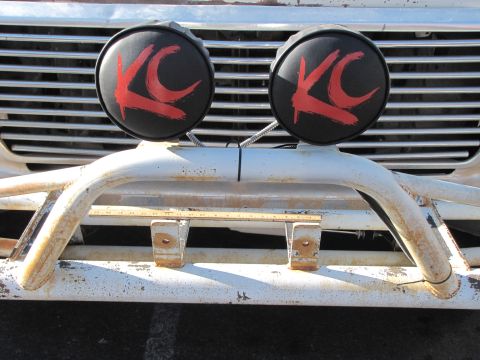 1978 Ford Bronco - Front view of a 1978 Ford Bronco with KC lights and a white bull bar.