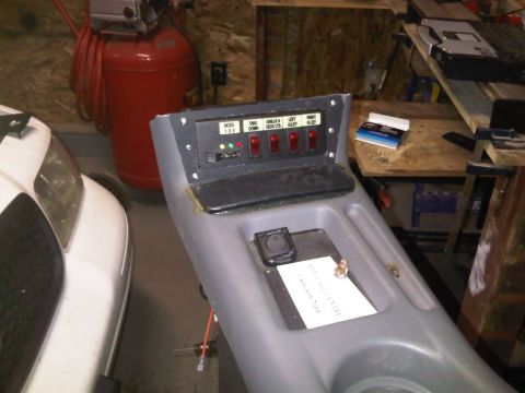 2003 Ford Crown Victoria - Custom control panel with multiple switches and indicator lights, likely for auxiliary functions.