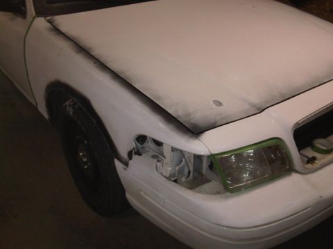 2003 Ford Crown Victoria - This vehicle appears to be undergoing bodywork, with primer and masking tape visible on the front end.
