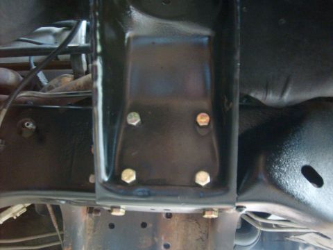 1986 Ford Bronco - Close-up view of the undercarriage of a vehicle, showing frame and suspension components.