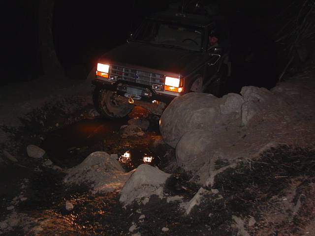 Surprisingly the old tired BFGs had some tenacious grip on these rocks even in spite of some moisture. Pulled the truck right on up with little fanfare. :)