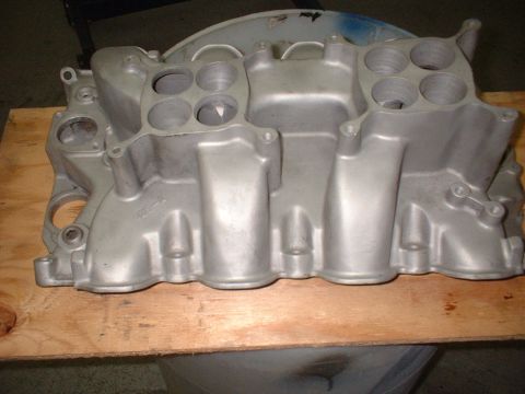 1965 Ford 427 - This aluminum intake manifold features eight ports for engine cylinders.