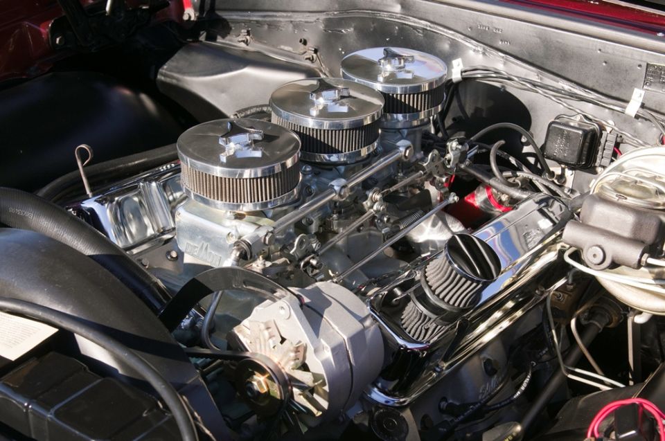 Engine with triple carburetors and chrome air cleaners