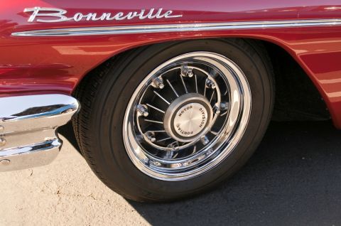 2006 Cadillac STS - Close-up of a red car's fender and wire wheel, showing the 'Bonneville' script.