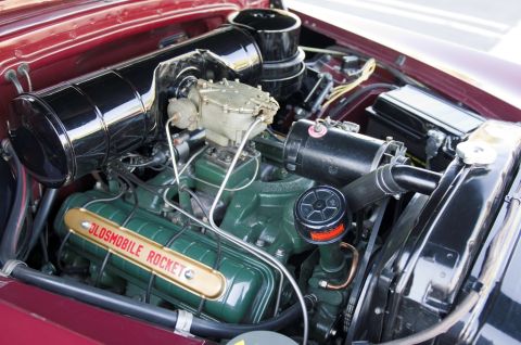 2006 Cadillac STS - Close-up view of a vintage engine compartment, highlighting the Oldsmobile Rocket branding on the valve cover.