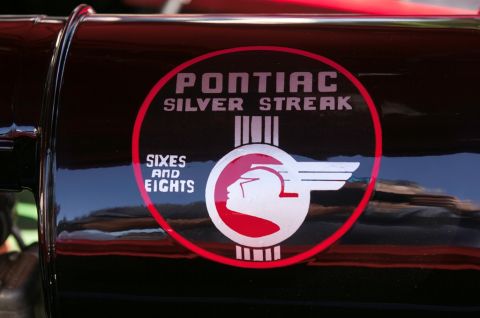 2006 Cadillac STS - Close-up of a Pontiac Silver Streak emblem, indicating Sixes and Eights models.
