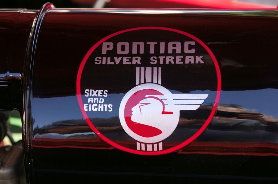 Pontiac Silver Streak Sixes and Eights emblem on black surface