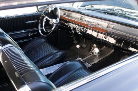 2006 Cadillac STS - The dashboard and seating of a classic automobile are shown in this interior shot.