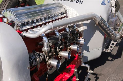 2006 Cadillac STS - Close-up of a custom engine with prominent exhaust pipes and intake manifolds.
