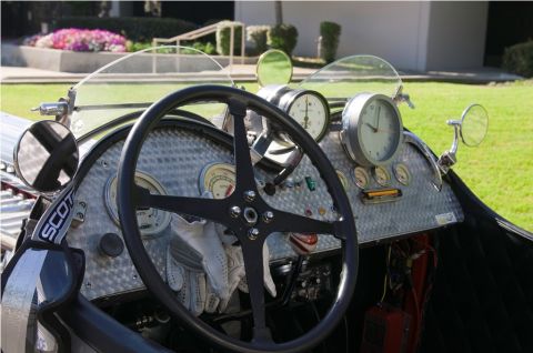 2006 Cadillac STS - Dashboard of a vintage car a steering wheel, numerous gauges, and a clock. 'SCOT' branding is visible.