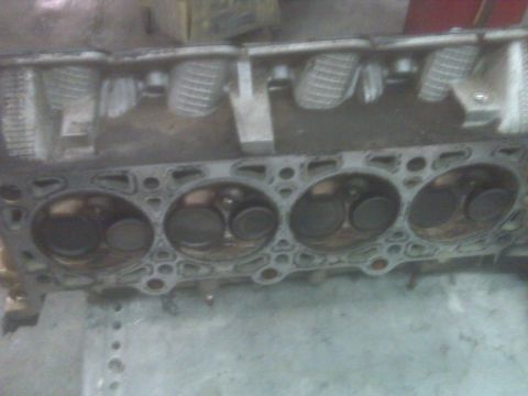 2001 Ford Crown Victoria - This is a close-up view of an engine's cylinder head, showing the combustion chambers and valves.