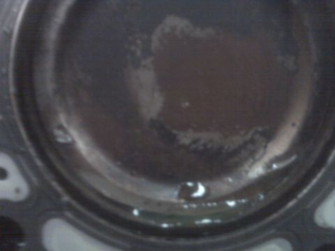 2001 Ford Crown Victoria - Close-up view of an engine cylinder showing fluid and residue.