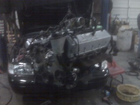 2001 Ford Crown Victoria - Engine installation in progress on a 2001 Ford Crown Victoria.