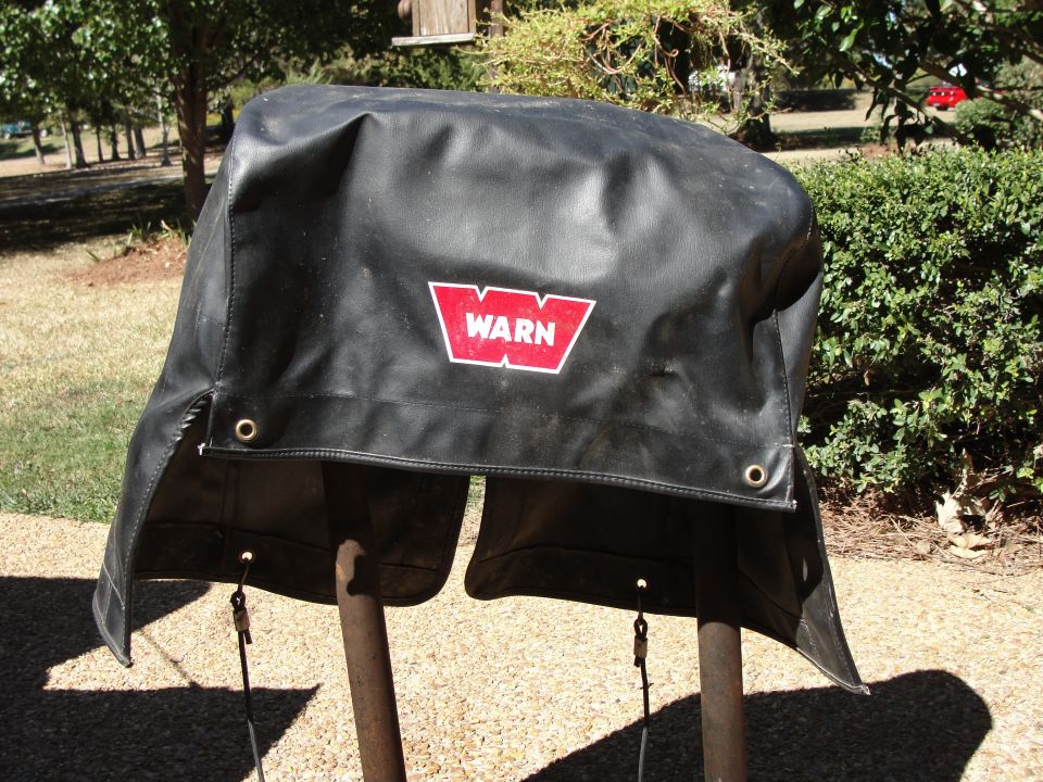 Black Warn winch cover with red logo