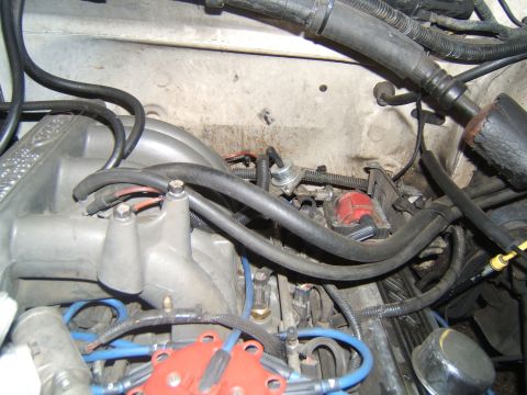 1988 Ford Bronco - Close-up view of an engine bay, showing mechanical components and wiring.