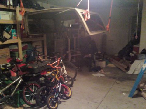 1987 Ford Bronco - Hung Top from ceiling with bike hooks and ratchet straps.